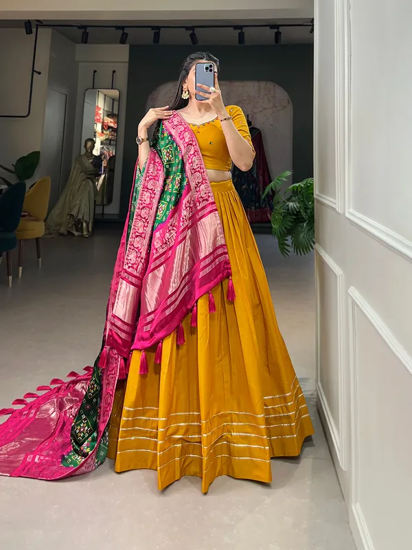 Step_into_a_world_of_elegance_and_grace_with_the_delicate_charm_of_pure_cotton_lehenga_and_the_lustrous_allure_of_gaji_silk_dupatta