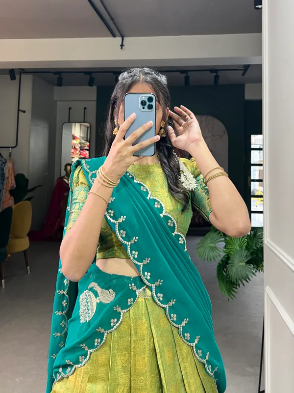 Experience_the_luxury_of_Kanjivaram_silk_in_this_regal_lehenga_choli_ensemble,_completed_with_a_flowing_embroidery_dupatta.