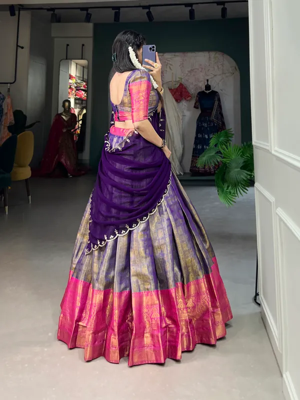 Experience_the_luxury_of_Kanjivaram_silk_in_this_regal_lehenga_choli_ensemble,_completed_with_a_flowing_embroidery_dupatta.