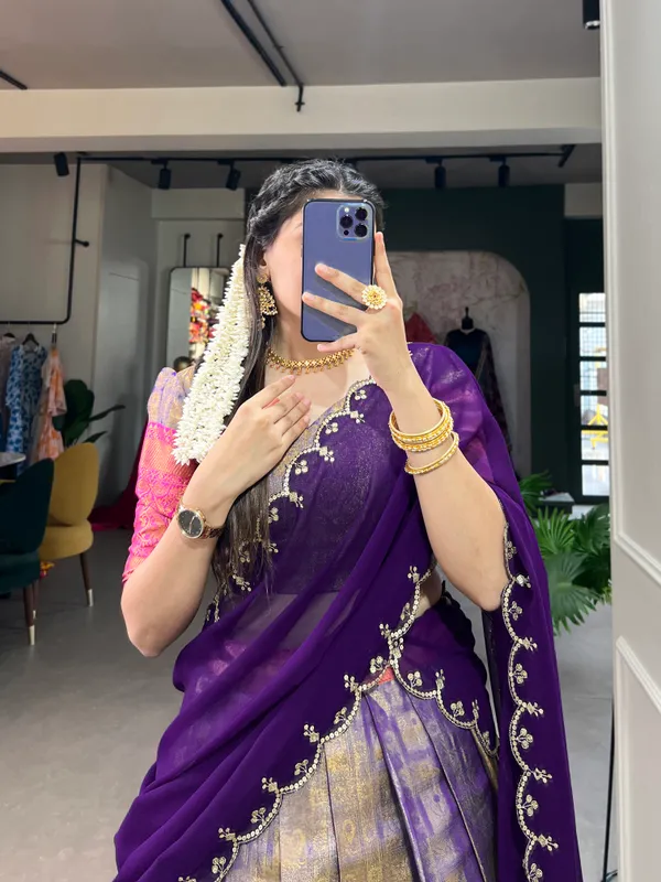 Experience_the_luxury_of_Kanjivaram_silk_in_this_regal_lehenga_choli_ensemble,_completed_with_a_flowing_embroidery_dupatta.