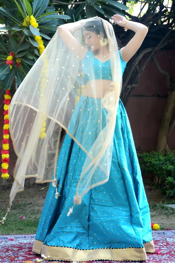 Teal_Blue_Silk_Lehenga_with_Net_Dupatta_and_Unstitched_Blouse