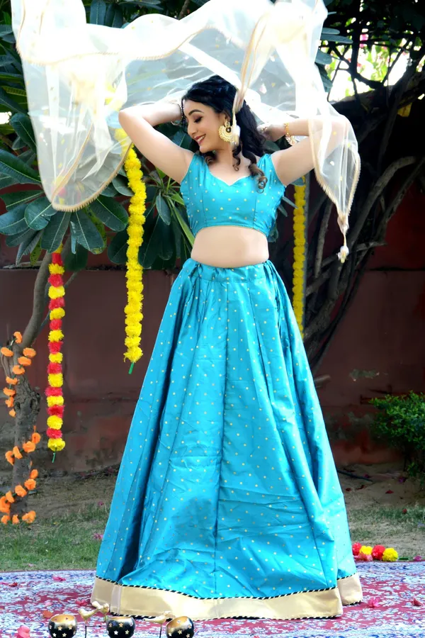 Teal_Blue_Silk_Lehenga_with_Net_Dupatta_and_Unstitched_Blouse