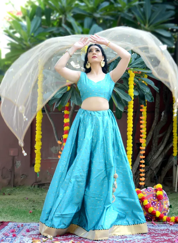 Teal_Blue_Silk_Lehenga_with_Net_Dupatta_and_Unstitched_Blouse