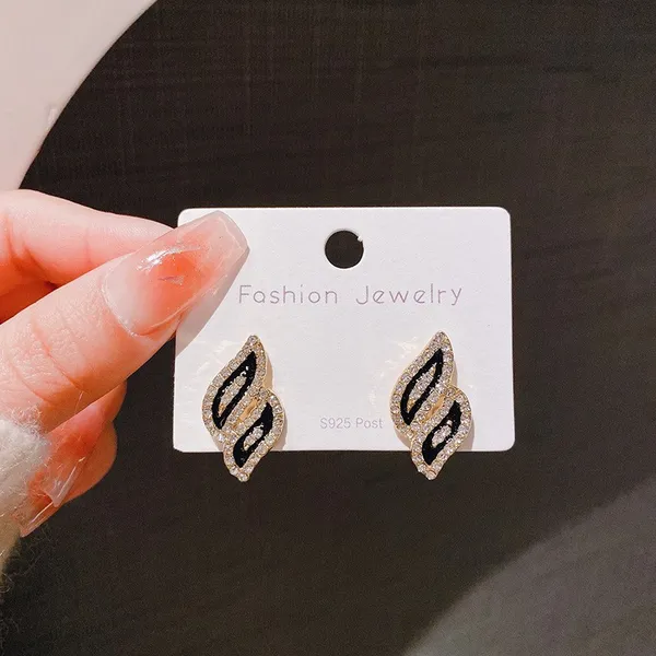 Black_colour_Wave_Leaf_Shape_Stud_embolished_with_golden_Zircon_for_women_&_girls,_Stylish,_Fashionable,_Korean_Jewelry