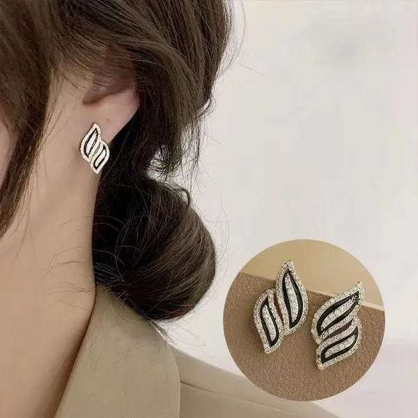 Black_colour_Wave_Leaf_Shape_Stud_embolished_with_golden_Zircon_for_women_&_girls,_Stylish,_Fashionable,_Korean_Jewelry