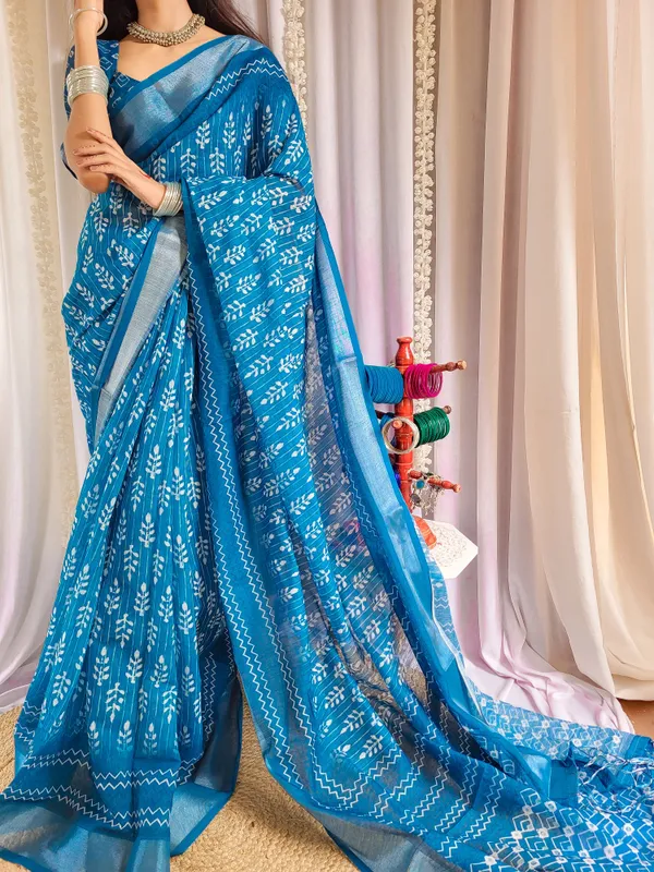 Elegant_Blue_Pure_Linen_Saree_with_Tassels_and_White_Floral_Patterns