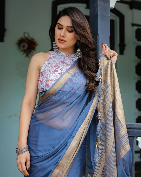 Serene_Steel_Blue_Plain_Chiffon_Saree_with_Gold_Zari_Border,_Floral_Printed_Blouse_&_Tassel_Detailing