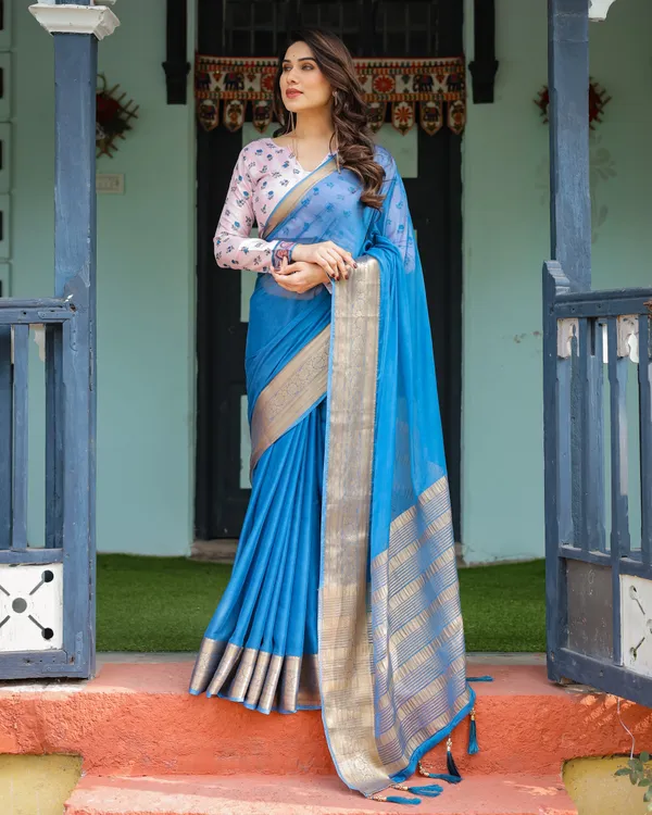 Vibrant_Sky_Blue_Plain_Chiffon_Saree_with_Gold_Zari_Border,_Floral_Printed_Blouse_&_Tassel_Accents