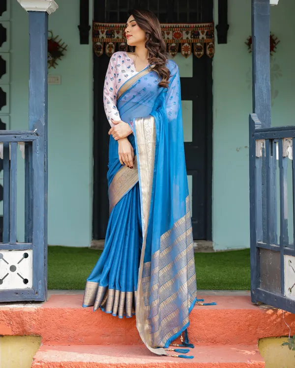 Vibrant_Sky_Blue_Plain_Chiffon_Saree_with_Gold_Zari_Border,_Floral_Printed_Blouse_&_Tassel_Accents