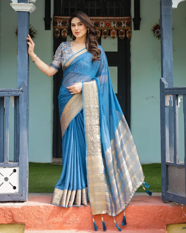 Vibrant_Peacock_Blue_Plain_Chiffon_Saree_with_Gold_Zari_Border,_Floral_Printed_Blouse_&_Tassel_Accents