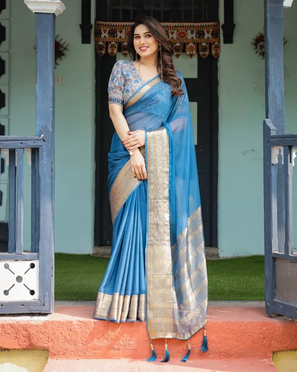 Vibrant_Peacock_Blue_Plain_Chiffon_Saree_with_Gold_Zari_Border,_Floral_Printed_Blouse_&_Tassel_Accents