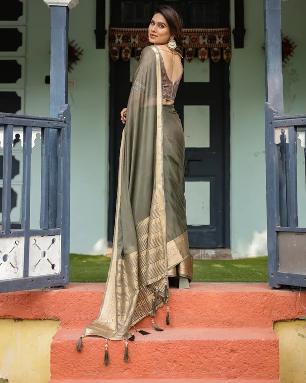 Elegant_Olive_Green_Plain_Chiffon_Saree_with_Gold_Zari_Border,_Floral_Printed_Blouse_&_Tassel_Detailing