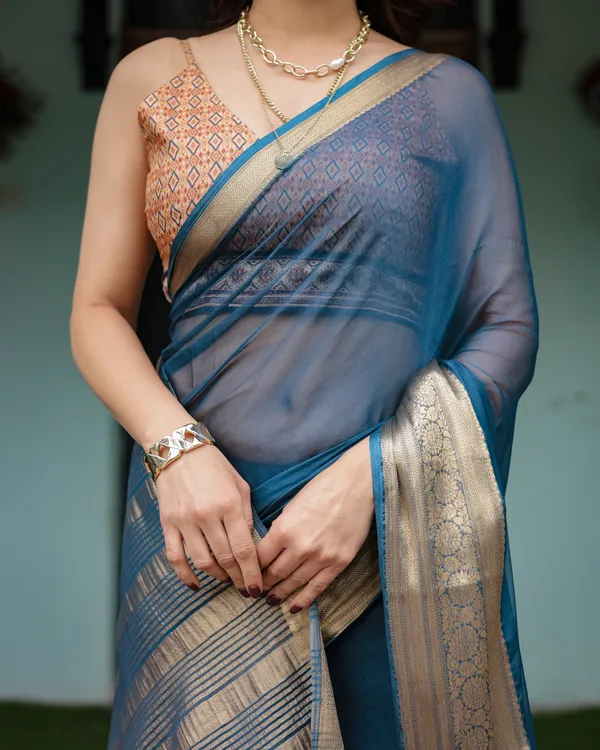 Teal_Blue_Plain_Chiffon_Saree_with_Gold_Zari_Border,_Geometric_Printed_Blouse_&_Tassel_Detailing