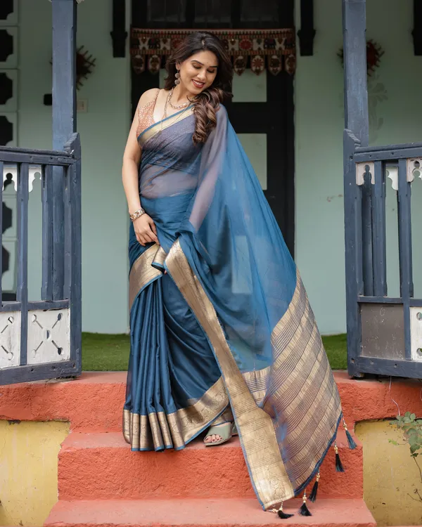 Teal_Blue_Plain_Chiffon_Saree_with_Gold_Zari_Border,_Geometric_Printed_Blouse_&_Tassel_Detailing
