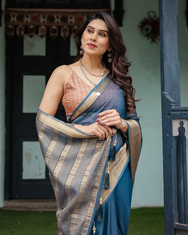 Teal_Blue_Plain_Chiffon_Saree_with_Gold_Zari_Border,_Geometric_Printed_Blouse_&_Tassel_Detailing
