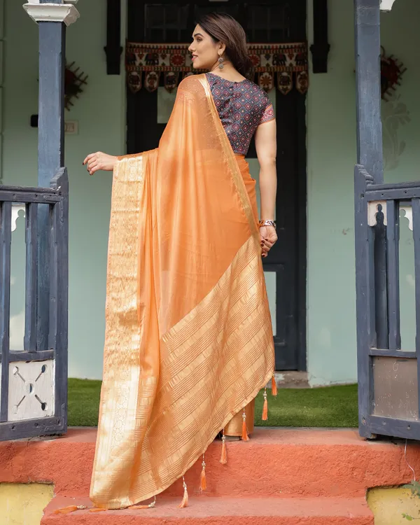 Elegant_Tangerine_Orange_Plain_Chiffon_Saree_with_Gold_Zari_Border,_Geometric_Printed_Blouse_&_Tassel_Detailing