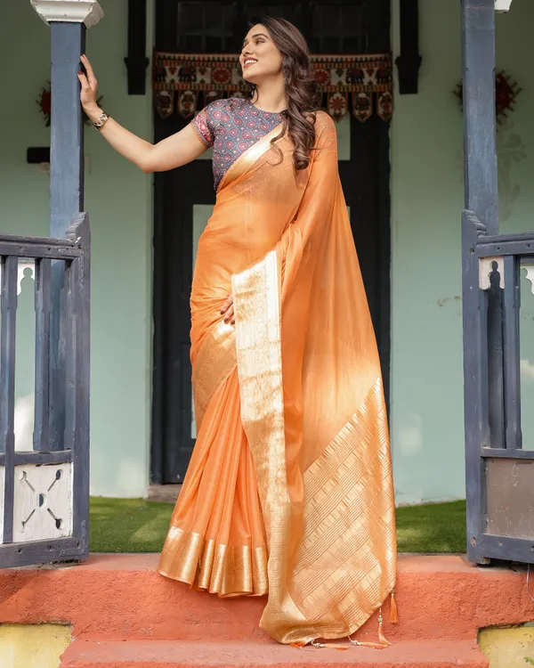 Elegant_Tangerine_Orange_Plain_Chiffon_Saree_with_Gold_Zari_Border,_Geometric_Printed_Blouse_&_Tassel_Detailing