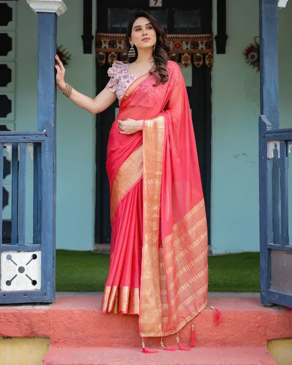 Vibrant_Coral_Pink_Plain_Chiffon_Saree_with_Gold_Zari_Border,_Floral_Ruffled_Blouse_&_Tassel_Detailing