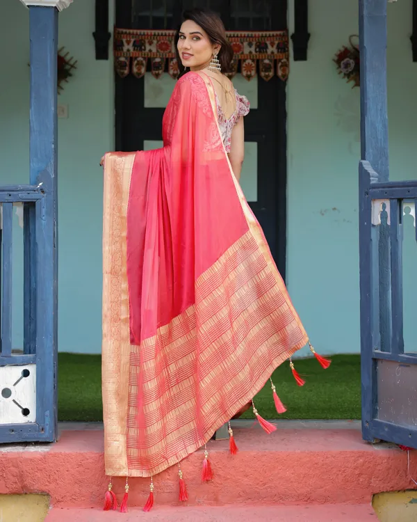 Vibrant_Coral_Pink_Plain_Chiffon_Saree_with_Gold_Zari_Border,_Floral_Ruffled_Blouse_&_Tassel_Detailing