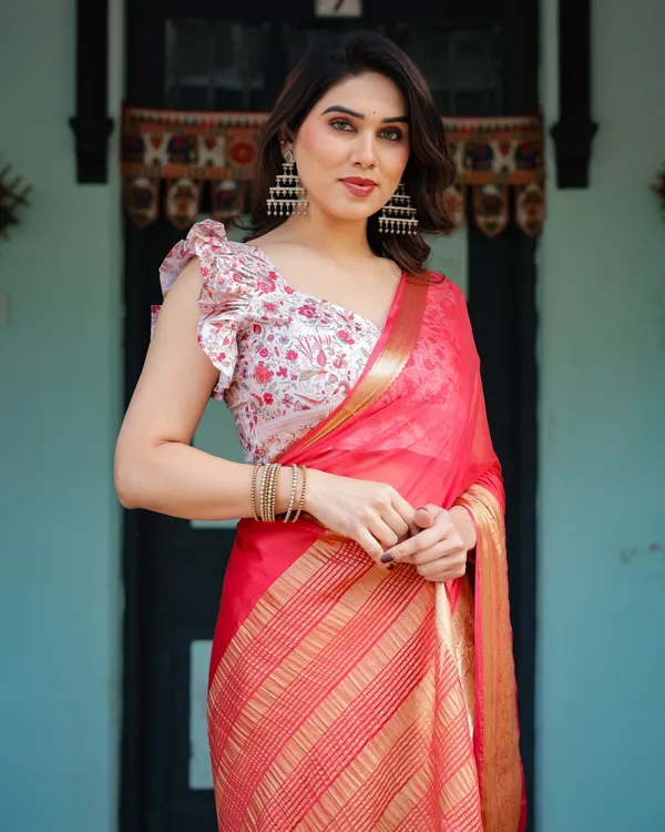 Vibrant_Coral_Pink_Plain_Chiffon_Saree_with_Gold_Zari_Border,_Floral_Ruffled_Blouse_&_Tassel_Detailing