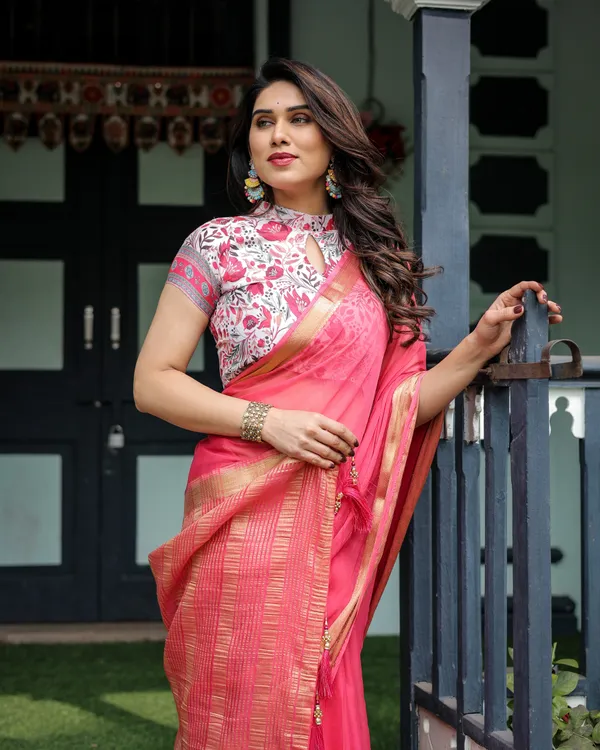 Raspberry_Pink_Plain_Chiffon_Saree_with_Gold_Zari_Border,_High-Neck_Floral_Printed_Blouse_&_Tassel_Detailing