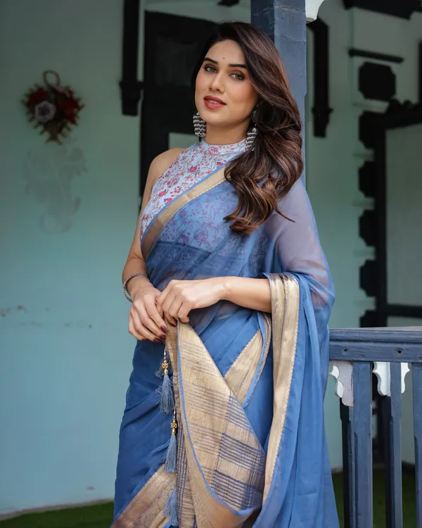 Serene_Steel_Blue_Plain_Chiffon_Saree_with_Gold_Zari_Border,_Floral_Printed_Blouse_&_Tassel_Detailing