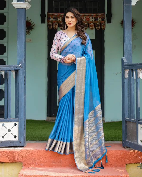 Vibrant_Sky_Blue_Plain_Chiffon_Saree_with_Gold_Zari_Border,_Floral_Printed_Blouse_&_Tassel_Accents