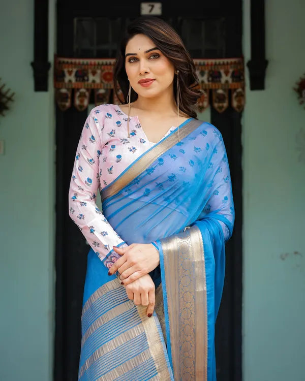 Vibrant_Sky_Blue_Plain_Chiffon_Saree_with_Gold_Zari_Border,_Floral_Printed_Blouse_&_Tassel_Accents