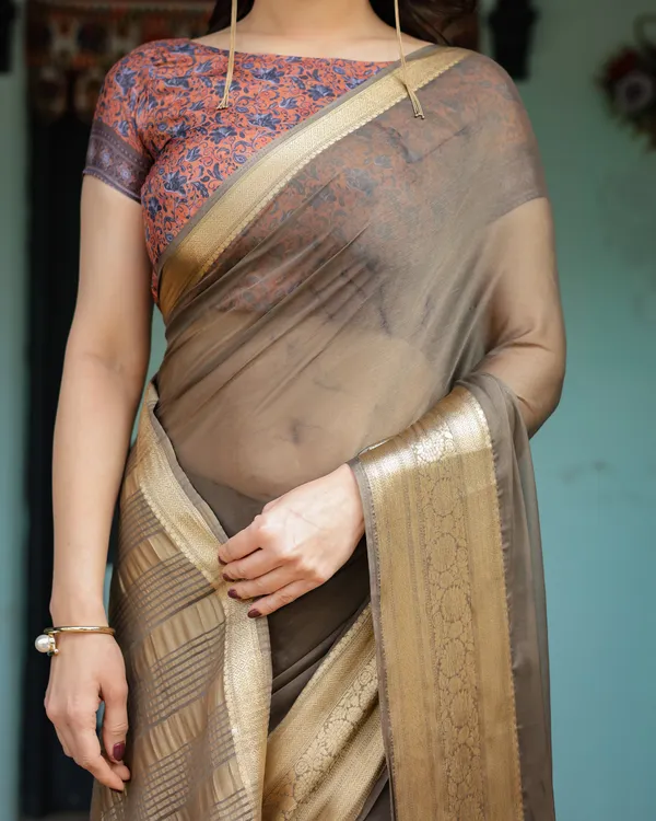 Elegant_Olive_Brown_Plain_Chiffon_Saree_with_Gold_Zari_Border,_Paisley_Printed_Blouse_&_Tassel_Detailing
