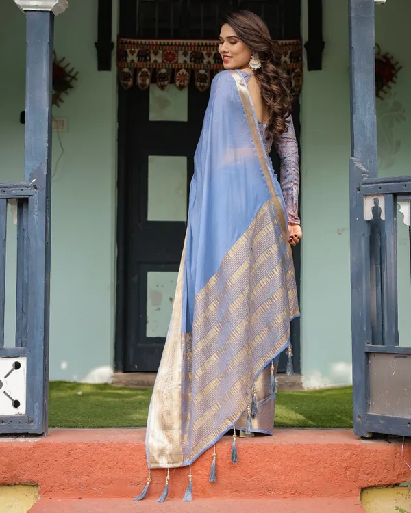 Sky_Blue_Plain_Chiffon_Saree_with_Gold_Zari_Border,_Geometric_Printed_Blouse_&_Tassel_Detailing