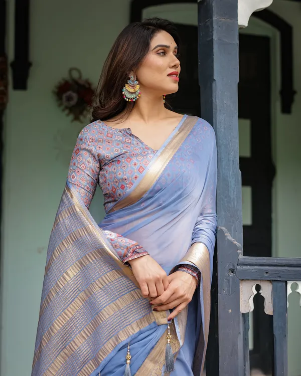 Sky_Blue_Plain_Chiffon_Saree_with_Gold_Zari_Border,_Geometric_Printed_Blouse_&_Tassel_Detailing