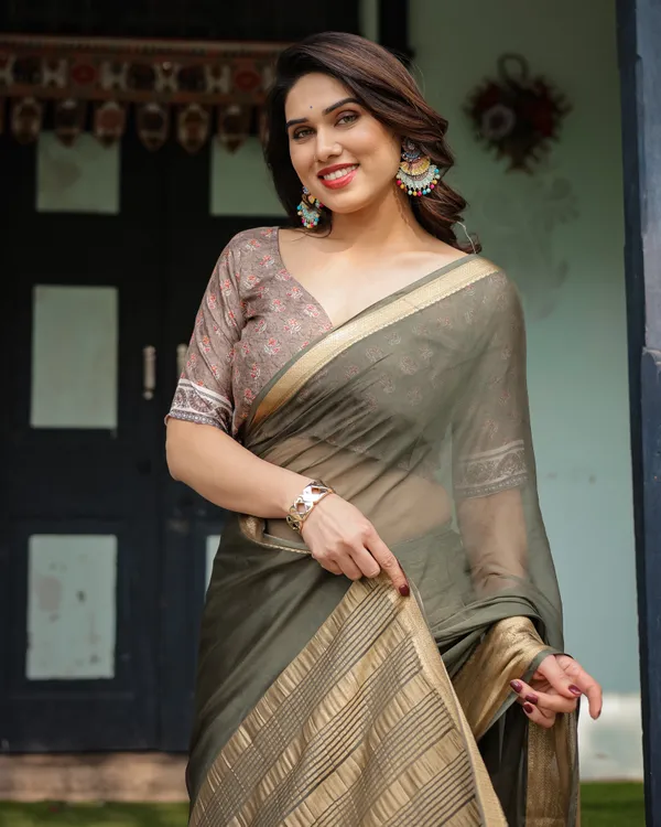 Elegant_Olive_Green_Plain_Chiffon_Saree_with_Gold_Zari_Border,_Floral_Printed_Blouse_&_Tassel_Detailing