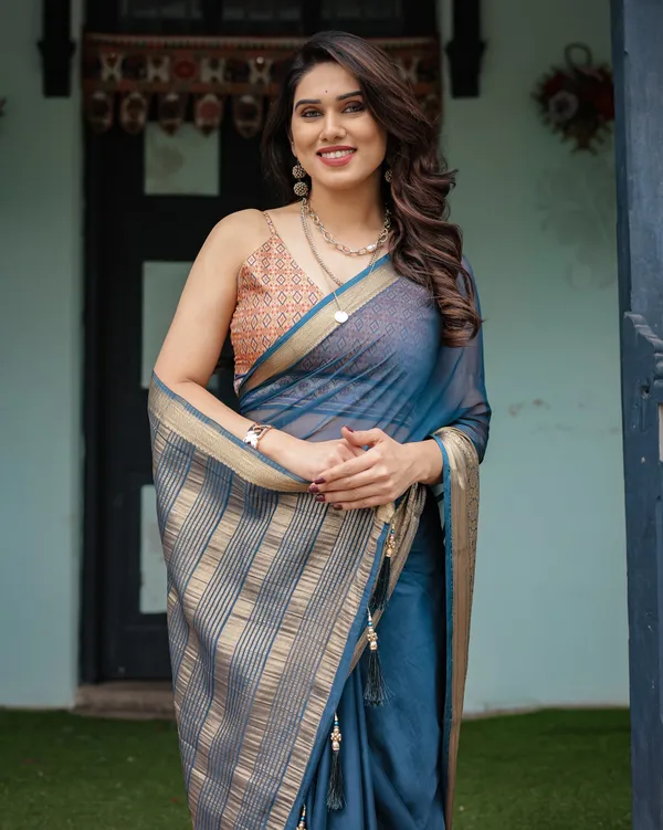 Teal_Blue_Plain_Chiffon_Saree_with_Gold_Zari_Border,_Geometric_Printed_Blouse_&_Tassel_Detailing