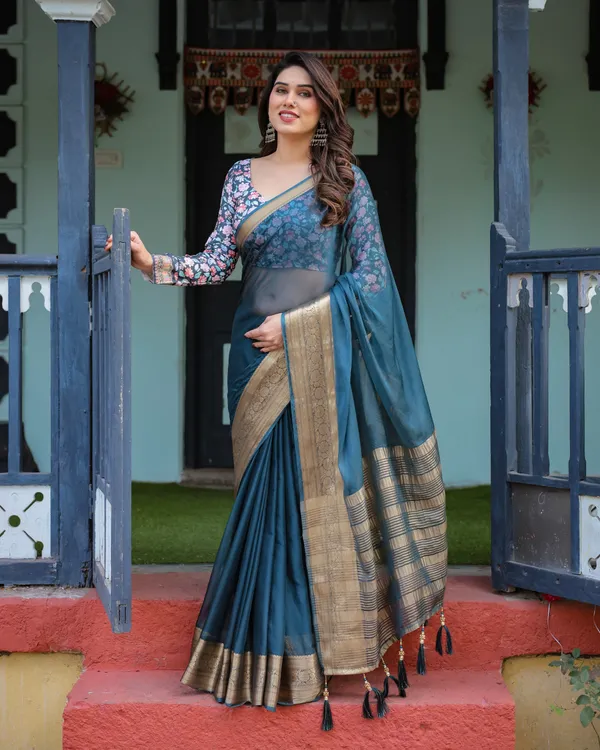 Teal_Blue_Plain_Chiffon_Saree_with_Gold_Zari_Border,_Floral_Printed_Blouse_&_Tassel_Detailing