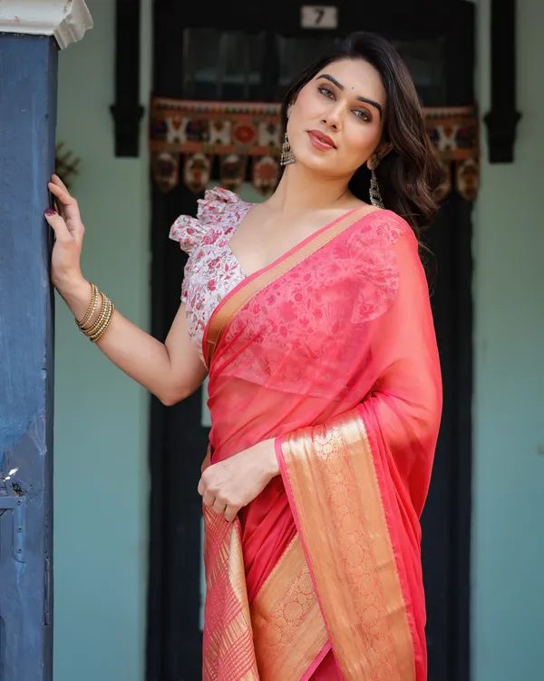 Vibrant_Coral_Pink_Plain_Chiffon_Saree_with_Gold_Zari_Border,_Floral_Ruffled_Blouse_&_Tassel_Detailing