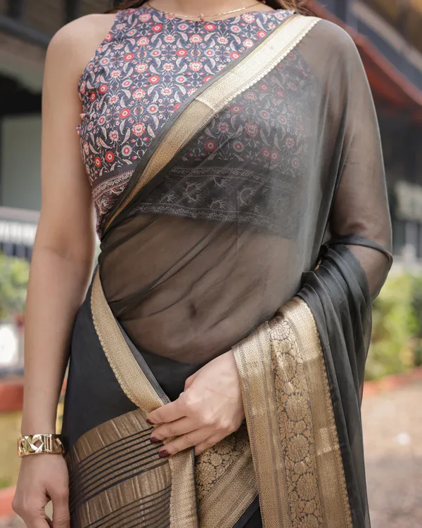 Ethereal_Black_Plain_Chiffon_Saree_with_Gold_Zari_Border,_Floral_Printed_Blouse_&_Tassel_Detailing