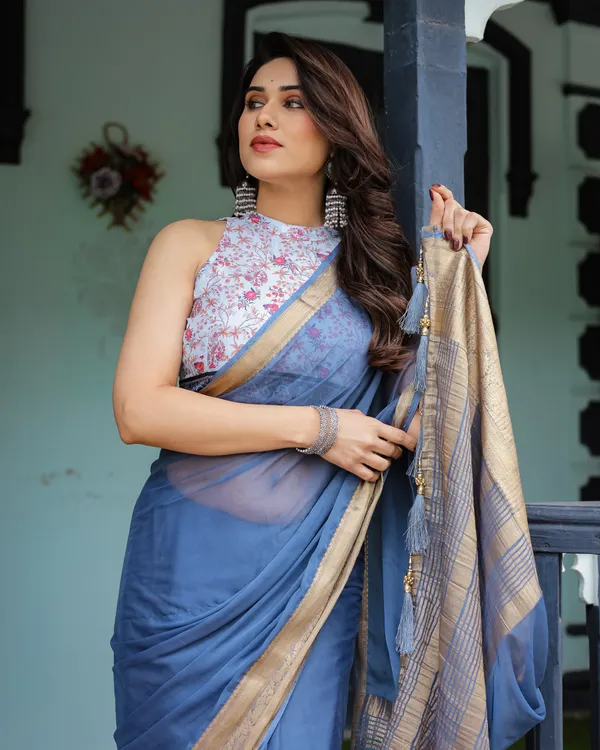 Serene_Steel_Blue_Plain_Chiffon_Saree_with_Gold_Zari_Border,_Floral_Printed_Blouse_&_Tassel_Detailing