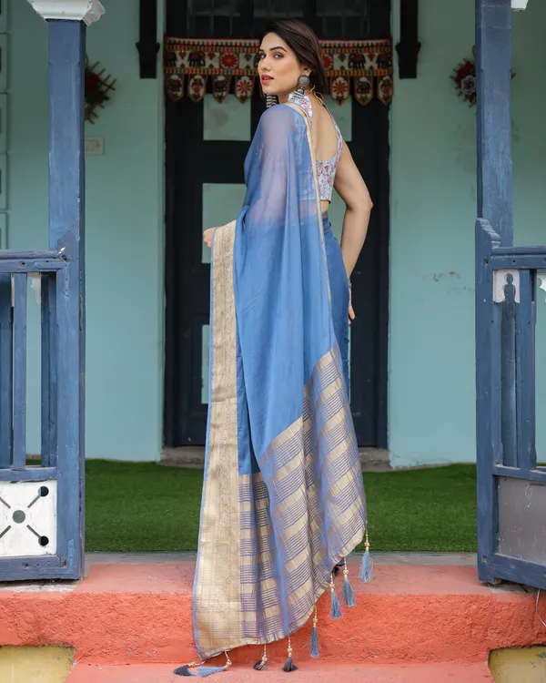 Serene_Steel_Blue_Plain_Chiffon_Saree_with_Gold_Zari_Border,_Floral_Printed_Blouse_&_Tassel_Detailing
