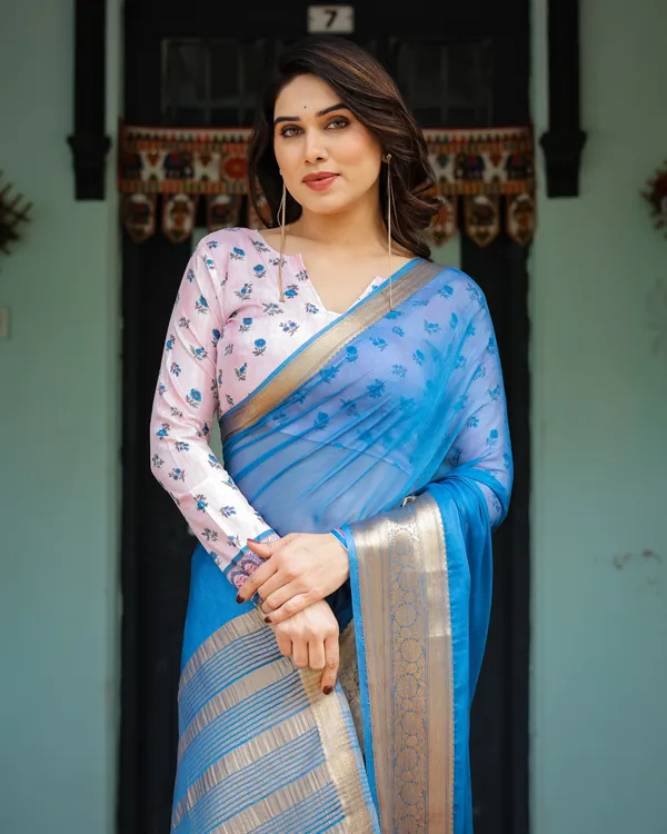 Vibrant_Sky_Blue_Plain_Chiffon_Saree_with_Gold_Zari_Border,_Floral_Printed_Blouse_&_Tassel_Accents
