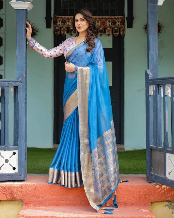 Vibrant_Sky_Blue_Plain_Chiffon_Saree_with_Gold_Zari_Border,_Floral_Printed_Blouse_&_Tassel_Accents