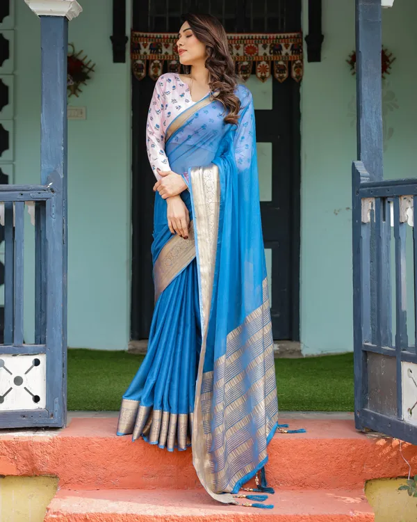 Vibrant_Sky_Blue_Plain_Chiffon_Saree_with_Gold_Zari_Border,_Floral_Printed_Blouse_&_Tassel_Accents