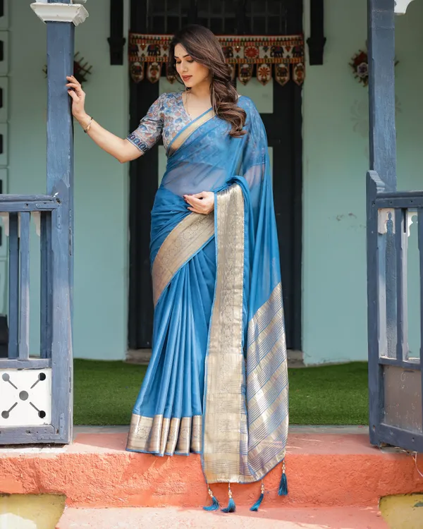 Vibrant_Peacock_Blue_Plain_Chiffon_Saree_with_Gold_Zari_Border,_Floral_Printed_Blouse_&_Tassel_Accents