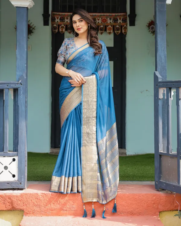 Vibrant_Peacock_Blue_Plain_Chiffon_Saree_with_Gold_Zari_Border,_Floral_Printed_Blouse_&_Tassel_Accents