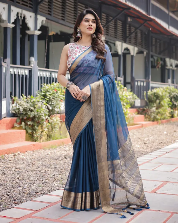 Deep_Navy_Blue_Plain_Chiffon_Saree_with_Gold_Zari_Border,_Floral_Printed_Blouse_&_Tassel_Accents