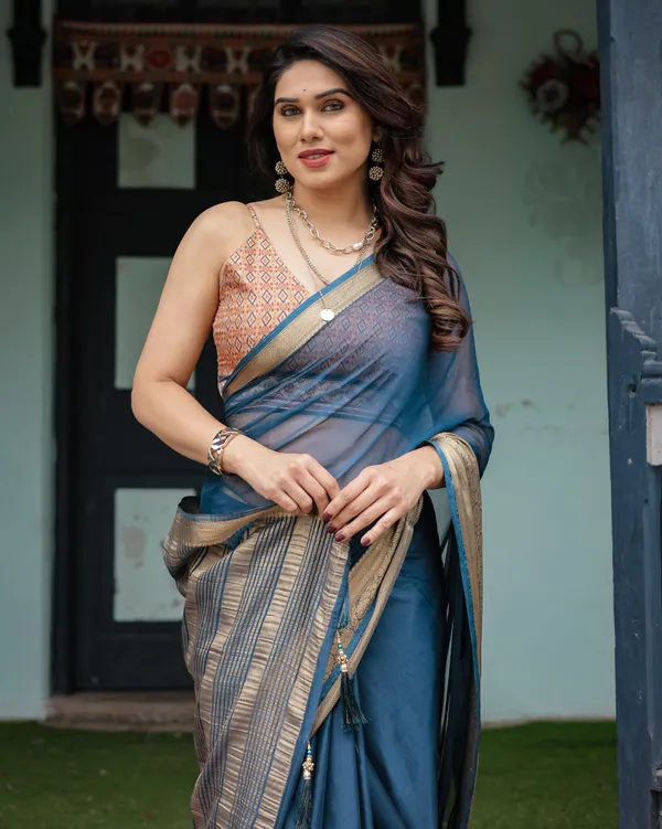 Teal_Blue_Plain_Chiffon_Saree_with_Gold_Zari_Border,_Geometric_Printed_Blouse_&_Tassel_Detailing