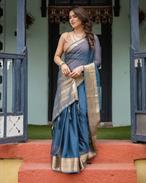 Teal_Blue_Plain_Chiffon_Saree_with_Gold_Zari_Border,_Geometric_Printed_Blouse_&_Tassel_Detailing