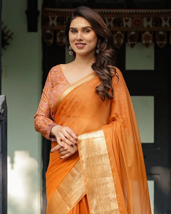 Sunset_Orange_Plain_Chiffon_Saree_with_Gold_Zari_Border,_Floral_Embroidered_Blouse_&_Tassel_Detailing