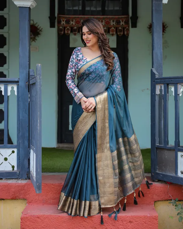 Teal_Blue_Plain_Chiffon_Saree_with_Gold_Zari_Border,_Floral_Printed_Blouse_&_Tassel_Detailing