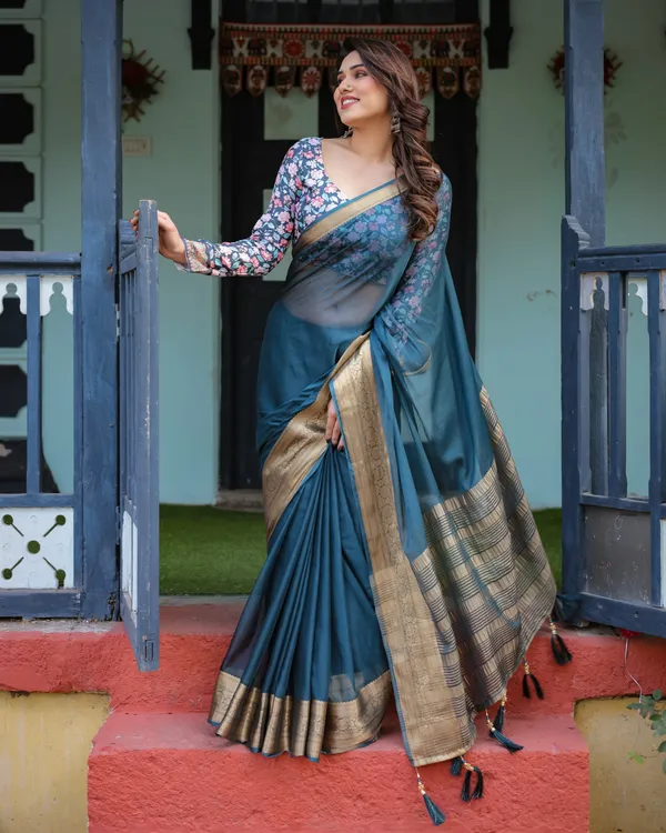 Teal_Blue_Plain_Chiffon_Saree_with_Gold_Zari_Border,_Floral_Printed_Blouse_&_Tassel_Detailing