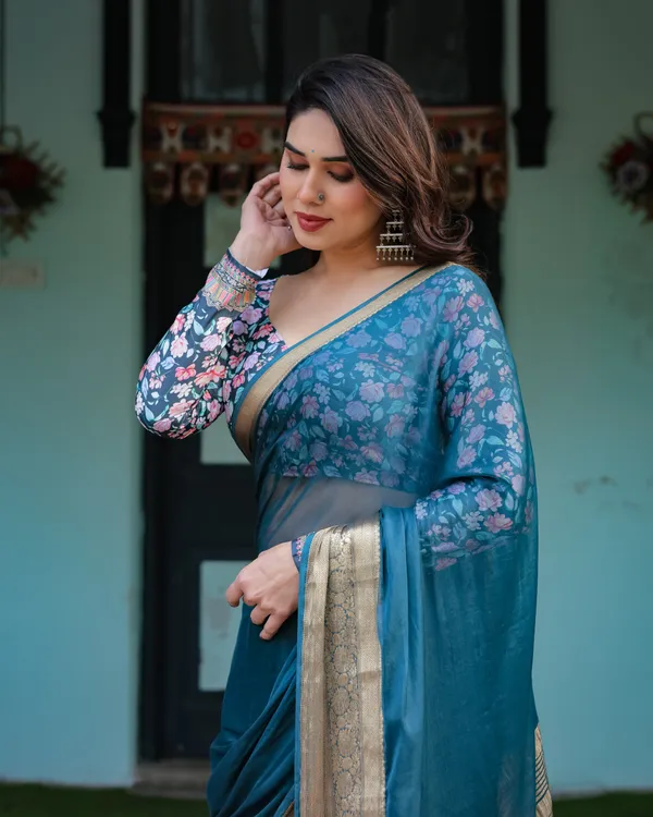 Teal_Blue_Plain_Chiffon_Saree_with_Gold_Zari_Border,_Floral_Printed_Blouse_&_Tassel_Detailing